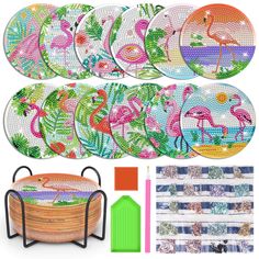 flamingos and palm leaves are on the table next to each other, including plates