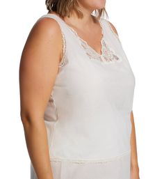 Easy to care for pure cotton camisole with gorgeous lace at the neck and adjustable straps. Deep V-neckline with Rochelle lace panels set into the base. Low-cut armholes. Panel set into back helps camisole fit closer and more naturally against the body. Wide satin non-stretch straps at back attach to neckline, and allow you to adjust fit with plastic hardware. Lace trim at neck, armholes, back, and hem. Relaxed fit. Pullover styling. Shadowline Women's Plus Cotton Batiste Camisole in White | Siz White Lace Patchwork Camisole Tank Top, White Camisole With Lace Patchwork, Daywear Lace Trim Cami Top, Daywear Cami Lace Top With Delicate Straps, Feminine Lace Patchwork Camisole Top, White Lace Patchwork Camisole, Elegant White Lace Patchwork Tank Top, Lace Daywear Camisole, Sleeveless Cotton Lace Top With Delicate Detail