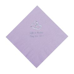 a purple napkin with two hearts and the words, love is always in silver on it