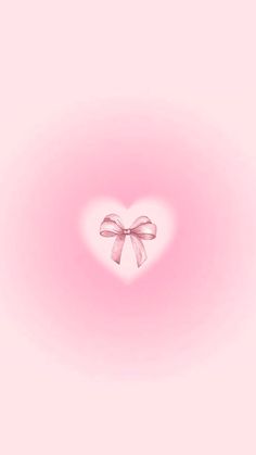 a pink background with a heart shaped bow