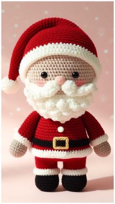 a crocheted santa clause doll is shown in red and white