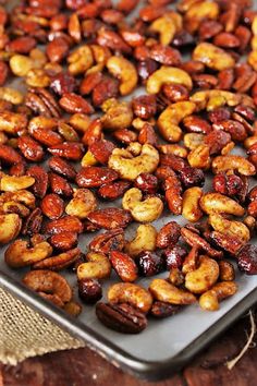 roasted nuts on a baking sheet ready to be cooked