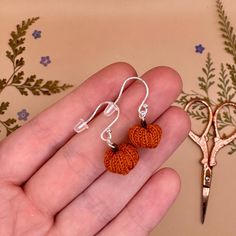 Handmade micro crochet pumpkin earrings! 🎃 each pair crafted by hand with top quality silver or gold hooks, for that perfect autumnal gift (whether for a loved one, or yourself!) 🌸 I make these earrings to order by hand with waxed cotton thread and a 0.4mm crochet hook, finished with high quality earring hooks in a metal of your choice 💛 This item makes a perfect gift for lovers of autumn, fall, Halloween, cosy fall vibes, witchy fashion, cottagecore accessories and artisanal jewellery. Each pair are handmade to order so you know that you are getting something that's completely unique ✨🧡 All earrings are available with either full 925 sterling silver, 925 silver plated, or 14ct gold filled earring hooks. 'Gold filled' is thicker and more durable than plated jewellery, so it is somewher Handmade Jewelry For Fall Gift, Handmade Dangle Jewelry For Fall, Halloween Crochet Earrings, Crochet Pumpkin Earrings, Crochet Earrings Halloween, Micro Crochet Pumpkin, Handmade Sterling Silver Halloween Earrings, Fashion Cottagecore, Cottagecore Halloween