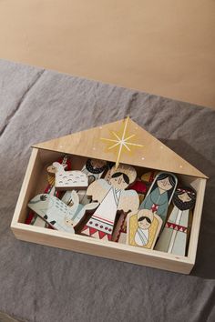 a wooden nativity set in a box