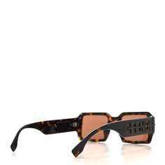 This is an authentic pair of FENDI Acetate Jacquard FF Fendigraphy Square Sunglasses FE40073U in Brown. These chic sunglasses feature brown lenses, classic brown frames with the Fendi FF logo. Chic Sunglasses, Ff Logo, Classic Brown, Square Sunglasses, Lenses, Fendi, Sunglasses, Square