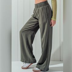 Smocked Waistband Wide Leg Pants, crafted from 100% Tencel for unparalleled comfort. These pants feature a mid-rise design and side pockets for added functionality. Perfect for resort vacations, cruises, beach days, festivals, concerts, or casual outings, they exude boho charm. Available in classic black, blue, light blue, olive, clay, and beige colors, and in sizes small, medium, and large, these pants are a versatile addition to any wardrobe. Embrace their flowy and comfy design for relaxed lo Cozy Tops, Self Design, Pantalon Large, Pull On Pants, Beige Color, Trousers Women, Mid Rise, Classic Black, Smocking