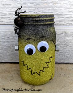 a painted mason jar with eyes, nose and mouth