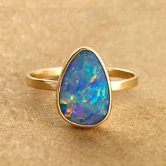 Fine Jewelry 14k Gold Opal Ring With Polished Finish, 14k Gold Opal Ring With Polished Finish, 14k Yellow Gold Opal Ring Birthstone, 14k Gold Opal Ring With Polished Finish For Promise, 14k Yellow Gold Opal Promise Ring, 14k Gold Opal Ring With Bezel Setting, 14k Gold Opal Ring With Polished Finish For Anniversary, Heirloom 14k Gold Opal Ring With Bezel Setting, Thick Gold Wedding Band