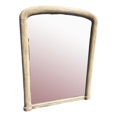 a mirror that is sitting on top of a wooden stand with an arch around it