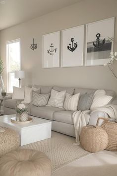 a living room filled with lots of furniture and pictures on the wall above it's windows