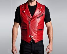 Hand Crafted 100% Genuine Cow Leather ♣ PRODUCT INFORMATION: This Handmade Men Handmade Biker Vest Red with: --> Turn down collar, --> Button closure, --> 1 breast zipper pocket, --> 2 waist pockets, --> Double stitched for more durability, --> Full satin lining for more comfort, --> Beautiful Construction and design, --> Genuine leather is our guarantee. ♣ Measurements Required: 🔸Actual Body Chest 🔸Cross Shoulder 🔸 Waist (measured from where you button up your pant) 🔸 Length (length you wan Red Biker Leather Jacket For Motorcycling, Red Punk Biker Jacket For Biker Events, Punk Red Biker Jacket For Biker Events, Red Biker Jacket For Motorcycling, Red Leather Biker Jacket, Edgy Red Biker Jacket For Biker Events, Edgy Red Outerwear For Biker Events, Steampunk Vest, Motorbike Leathers