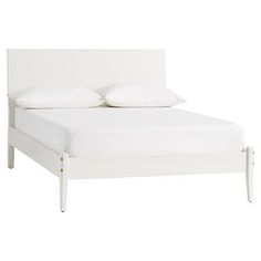 a white bed with two pillows on top of the headboard and foot board, in front of a white background