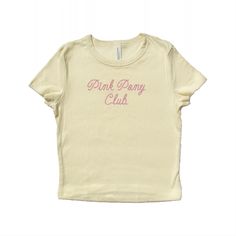 Baby tee with "Pink Pony Club" written in a cowboy rope font and embroidered in pink polyester thread.  The perfect gift for a fan! <3 Drop down menu will reflect the color options shown. Please refer to the size chart on the last slide for accurate measurements. Baby tee fabrication: 52% airlume combed and ring-spun cotton, 48% polyester 32 single, 5.4oz Want a different embroidery color? Message us! We have a large variety of colored thread to choose from. Unisex Pink T-shirt For Spring, Pink T-shirt For Spring, Cute Pink T-shirt With Letter Embroidery, Trendy Unisex Pink Top, Pink Unisex Tops For Spring, Basic Pink Slogan Top, Pink Cotton T-shirt With Letter Embroidery, Spring Pink Tops With Letter Embroidery, Spring Pink Top With Letter Embroidery