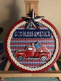 a red truck with an american flag painted on it's side and the words godless america