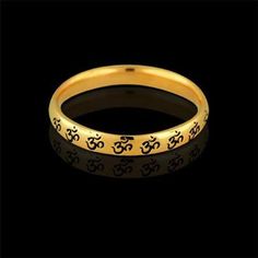 OM AUM Wedding Ring Gold Eternity Om Band Religious Wedding Black Painting Unisex Antique Finish Anniversary The OM (or AUM) sign is the main symbol of Hinduism. Most religions indicate that creation began with sound-- In the beginning was the word... For the Hindus & Buddhists, Om is the primordial sound, the first breath of creation, the vibration that ensures existence. Om sign signifies God, Creation, & the One-ness of all creation. This band is made of 14k yellow gold and is 2.7mm w Black Bangle For Wedding, Symbolic Yellow Gold Wedding Rings, Symbolic Stackable Wedding Rings, Symbolic Wedding Toe Rings, Symbolic Round Band Wedding Rings, Symbolic Wedding Rings With Round Band, Symbolic Wedding Toe Ring Jewelry, Symbolic Stackable Wedding Jewelry, Symbolic Black Jewelry For Wedding