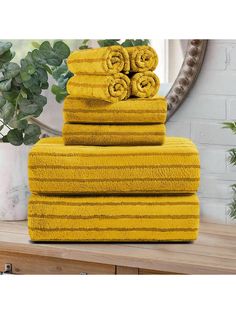 yellow towels stacked on top of each other