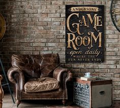 an old fashioned leather chair in front of a brick wall with a game room sign on it