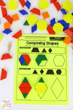 comparing shapes worksheet with colored paper and confetti on the table next to it