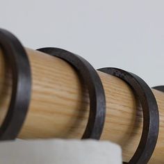 three wooden and metal rings on top of each other