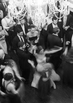 a black and white photo of people dancing