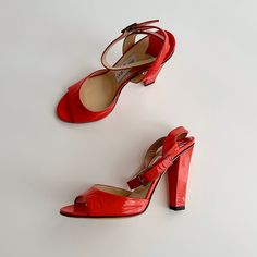 Jimmy Choo Patent Leather Strappy Heel Sandals Fun & Vibrate Red Orange Sandals With A Comfortable Heel Shoes Only, 100% Authentic Great Pre-Owned Condition: Never Worn, Please Note Creasing At Toe & Ankle Straps, Very Light Scuffs At Soles Size: Eu 35.5 (Approx Us Women’s 5-5.5) Approx 2.75” Insole Length Approx 8.8” Insole Width Color: Red Orange Details: O Round Open-Peep Toe O Wrap Around Ankle Strap With Buckle Closure O Padded Footbed O Approx. 4” Heel O Made In Italy Materials: Patent Lea Red Patent Leather Sandals With Round Toe, Red Open Toe Sandals With Branded Heel Counter, Patent Leather Sandals With Red Sole For Spring, Spring Patent Leather Sandals With Red Sole, Red Patent Leather Sandals For Spring, Red Patent Leather Ankle Strap Sandals, Red Party Sandals, Red Patent Leather Open Toe Sandals, Red Ankle Strap Sandals Medium Width