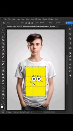 a young man wearing a t - shirt with an emoticive face on it