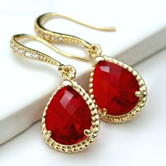 "These beauties are standouts! Perfect for that special occasion! Elegant  jeweled, french earrings carry stunning, red teardrop crystals with a gold rope trim. The crystal detail on these earrings give them such a classy and sophisticated feel. * 16k Gold Plated French Earrings * Swarovski Crystal Detailing * Red Faceted Crystal- 19 x 12mm(3/4x1/2\") including rope * Tarnish Resistant * Length- 32mm(1 1/4\") These earrings come in an organza bag and gift box." French Earrings, Elegant Gold Necklace, Teardrop Bridal Earrings, Pear Earrings, Crystal Wedding Jewelry, Crystal Teardrop Earrings, Necklace Swarovski, Unusual Earrings, Bride Earrings