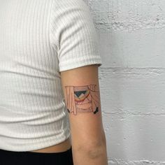 a woman's arm with a small tattoo on the left side of her body