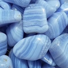 some blue marbles are stacked together on top of each other