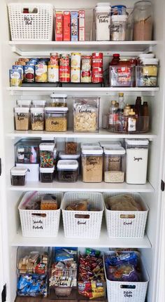 an organized pantry filled with lots of food and storage bins on the bottom shelf