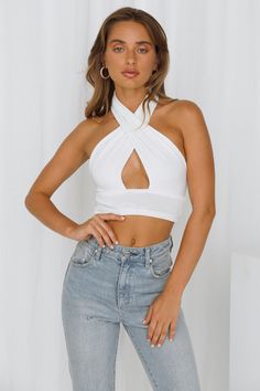 Length from shoulder to hem of size S: 42cm. White crop top. Lined. Cold hand wash only. Model is a standard XS and is wearing size XS. True to size. Light-weight, soft stretchy fabric. No zipper. Slip-on style. Polyester/Spandex. Simplicity with a bit of fun? We got you!! The Bakers Delight Crop Top will become your wardrobe essential. This little crop features a deep v-neck, with a thick band under the bust, has an open back and has a halterneck detail. Simple, but everything you need! Style y Crop Top Blanco, Bakers Delight, Colorful Midi Dress, Shift Dresses Work, Dress Extender, Cropped Tops, Midi Dress Casual, Midi Maxi Dress, White Crop