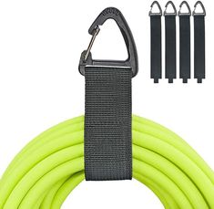 the green hose is being held up by three black handles and four gray clips on each end