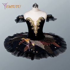 a black and gold tutule dress with flowers on the bottom, sitting on a mannequin