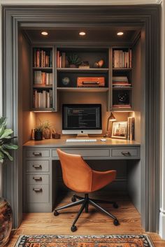 a home office with built in bookshelves and desk