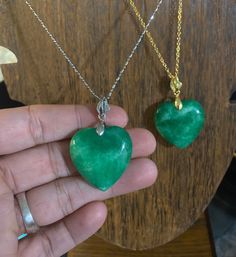 Beautiful polished natural jade stone heart necklaces. In gold colored or stirling silver. Jade is well known stone for good fortune and luck, prosperity. Great hues of greens all throughout the stones. Green Jade Heart Necklace, Emerald Heart Pendant Necklace As A Gift, Heart-shaped Emerald Necklaces As A Gift, Heart-shaped Emerald Necklace As A Gift, Heart Shaped Emerald Necklace As A Gift, Heart-shaped Emerald Necklace For Gift, Emerald Heart Gemstone Necklace, Emerald Heart Shaped Gemstone Necklace, Heart-shaped Emerald Gemstone Necklace