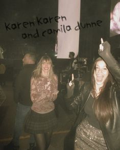 two women standing next to each other in front of a sign that says, karni karren and carolina dunne