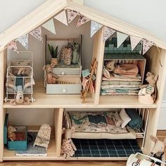 a doll house with lots of furniture and decorations