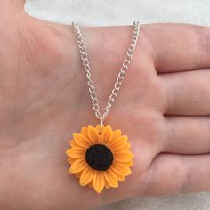 Silver plated chain necklace with orange sunflower charm You can pick your necklace length from: 16 inches 18 inches 20 inches 22 inches 24 inches Comes in an organza bag 💫💫 Summer Flower Charm Necklace As A Gift, Summer Flower Charm Necklace For Gift, Summer Gift Jewelry With Sunflower Design, Summer Flower Charm Necklace As Gift, Summer Gift Necklace With Flower Charm, Summer Flower Pendant Necklace For Gift, Yellow Sunflower Design Jewelry Gift, Summer Orange Flower-shaped Jewelry, Nickel-free Orange Necklace As Gift