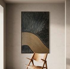 a wooden chair sitting in front of a painting on the wall next to a window