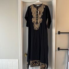 Never Worn. Gorgeous Long Embroidered Dress, Perfect For A Beach Trip Or To Wear For An Indian Wedding. Black Long Dress With Intricate Embroidery, Long Black Dress With Intricate Embroidery, Fitted Black Kurta With Gold Embroidery, Black Dress With Gold Embroidery For Festive Occasion, Festive Black Dress With Gold Embroidery, Black Tunic Dress For Festive Occasions, Festive Black Embroidered Maxi Dress, Embroidered Black Tunic Kurta, Traditional Black Dress With Embroidered Hem