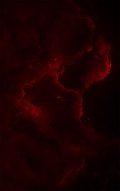 an abstract red and black background with some dark clouds in the center, as well as stars