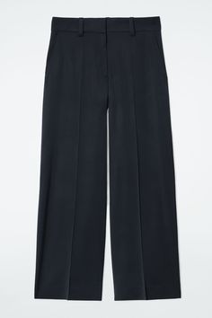 This season, the womenswear team refresh signature tailoring through modern fabrics. Offered in a deep-midnight hue, these flowy pants feature wide leg with pressed creases and a clean waistband with an adjustable tab for a bespoke fit. They're crafted with a hint of wool for tactility and have a buttoned welt pocket at the back. Relaxed fitHook-and-bar and zip closureECOVERO™ is a trademark of Lenzing AG. Viscose fibers are derived from certified renewable wood sources using a lower environment Cos Trousers, Flowy Trousers, Modern Fabrics, Faux Shearling Coat, Velvet Shirt, Flowy Pants, Ribbed Knit Top, Shearling Coat, Silk Pants