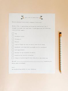 a checklist with a pencil next to it on top of a pink tablecloth