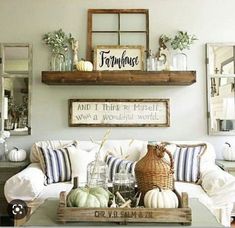 a living room filled with lots of furniture and decor on top of a coffee table