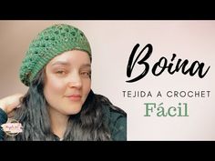 a woman wearing a green crochet hat with the words bona on it