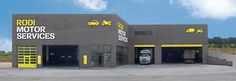 an image of a car repair shop that looks like it has been painted black and yellow