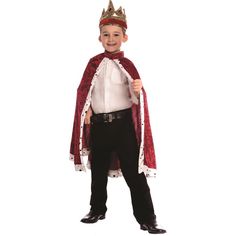 a little boy dressed in a king costume with a crown and holding a staff on his shoulder