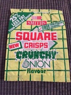 there is a square sign on the ground that says square crispes crunchy onion flavor