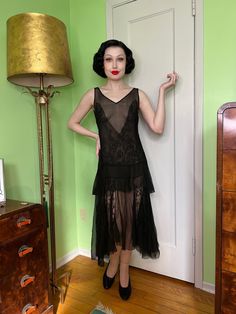 For sale is a vampy 1920s dress made of fine silk chiffon and lace The dress features lace contrast fabric, a soft v neck to accent the deep v neck, and a 2 tier skirt with an asymmetrical front hem. A *very* 1920s vamp silhouette. It's a very risqué cut of dress. I'd assume one might've worn a slip underneath of it but I think one could get away with wearing a half slip (bottom half)... but that's just what I would do! Please style this accordingly to your preference and comfort <3 The dress is in nearly excellent as is vintage condition with only a few small flaws to keep in mind: a small section of hem is missing (but easily gets lost in the full skirting), a smattering of small holes in one section in the full skirting, and a tiny speck of paint(?) in the skirting. This is me being ove 1920s Mini Dress, 1920s Cocktail Dress, 20s Slip Dress, 1920s Womens Fashion, 1920s Vamp, Vintage Slip Dress 1920s, 1920s Glam, 1920s Dress Vintage, Asymetrical Dress