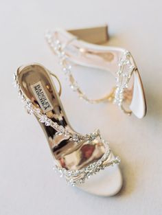 two pairs of wedding shoes with pearls on them